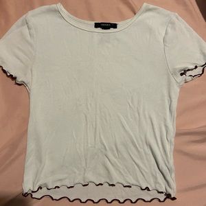 Short sleeve forever 21 white shirt. Maroon ruffle lined.
